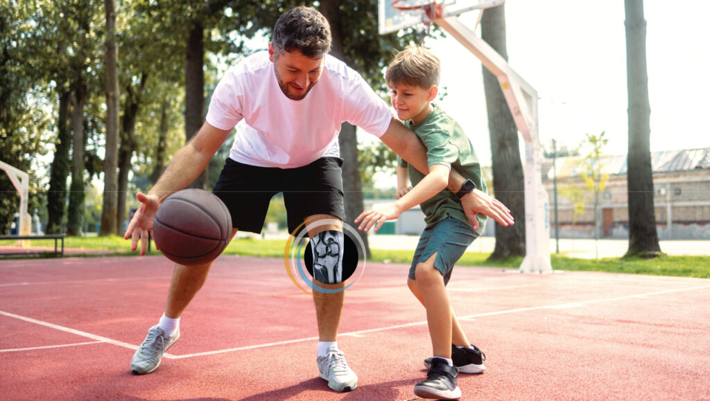 Father and son playing basketball.